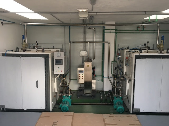 The substrate bags are loaded on racks and pushed into our autoclaves for sterilisation, together with the organic grain bags.